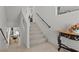 Bright staircase with neutral carpet leading to the upper level and lower level pool area at 9742 Toad Hollow St, Las Vegas, NV 89141