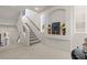 Carpeted staircase with glass railings and natural light from the windows at 9742 Toad Hollow St, Las Vegas, NV 89141