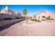 Spacious, low-maintenance backyard features decorative gravel, mature landscaping and privacy at 9817 Kernville Dr, Las Vegas, NV 89134
