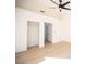 Bedroom with wood-style flooring, closet with open door, and plenty of natural light at 9817 Kernville Dr, Las Vegas, NV 89134