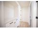 Bright hallway features custom built-in shelving, modern wood-look flooring, and access to various rooms at 9817 Kernville Dr, Las Vegas, NV 89134