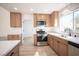 A bright kitchen featuring stainless appliances, light wood cabinets and a window above the sink at 9817 Kernville Dr, Las Vegas, NV 89134