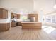 Bright, open kitchen with stainless appliances, light wood cabinets, an island and large windows for lots of natural light at 9817 Kernville Dr, Las Vegas, NV 89134