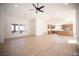 Spacious open-concept room with wood-style floors and plenty of natural light at 9817 Kernville Dr, Las Vegas, NV 89134