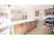 Open living space with a large island, lots of cabinetry, stainless appliances and seamless access to other rooms at 9817 Kernville Dr, Las Vegas, NV 89134
