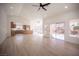 Open-concept living room and kitchen with stainless steel appliances and lots of natural light at 9817 Kernville Dr, Las Vegas, NV 89134