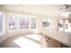Sunroom features lots of natural light, wood floors, neutral walls and backyard views at 9817 Kernville Dr, Las Vegas, NV 89134