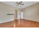 Bright bedroom featuring hardwood floors, a ceiling fan, and easy access to other areas of the home at 100 Woolman Rink Ave, Las Vegas, NV 89123