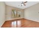 Bedroom featuring hardwood floors and shuttered windows at 100 Woolman Rink Ave, Las Vegas, NV 89123