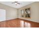 Bedroom with hardwood floors, neutral walls and shuttered windows at 100 Woolman Rink Ave, Las Vegas, NV 89123