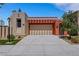 Charming single-Gathering home featuring a neutral palette and an attached two-car garage with an extra-long driveway at 100 Woolman Rink Ave, Las Vegas, NV 89123