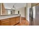 Kitchen with bar seating and views into the living room at 100 Woolman Rink Ave, Las Vegas, NV 89123