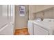 Laundry room featuring a washer, dryer, and shelving at 100 Woolman Rink Ave, Las Vegas, NV 89123