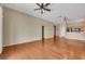 Bright, open-concept living room features hardwood floors with easy access to the kitchen and multiple hallways at 100 Woolman Rink Ave, Las Vegas, NV 89123