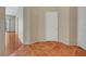 Hallway room featuring terra cotta tile flooring and white trim at 100 Woolman Rink Ave, Las Vegas, NV 89123