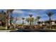 Gated community entrance with mature landscaping and visible street signs at 1000 Duckhorn Ct # 102, Las Vegas, NV 89144