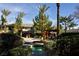 Community hot tub area is surrounded by a seating area and landscape at 1000 Duckhorn Ct # 102, Las Vegas, NV 89144