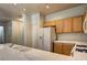 Bright kitchen with tiled countertops, tile floors, and white appliances at 1000 Duckhorn Ct # 102, Las Vegas, NV 89144