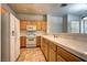 Spacious kitchen with tile floors, white appliances, and tile countertops at 1000 Duckhorn Ct # 102, Las Vegas, NV 89144