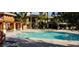 Community swimming pool with lounge seating and well maintained landscape at 1000 Duckhorn Ct # 102, Las Vegas, NV 89144