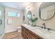Modern bathroom features double vanity with marble countertop and sleek black fixtures at 10205 Birch Bluff Ln, Las Vegas, NV 89145