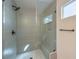 Modern walk-in shower with a glass door, rainfall shower head and built-in bench at 10205 Birch Bluff Ln, Las Vegas, NV 89145