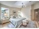Bright bedroom with natural light, stylish decor, and hardwood floors at 10205 Birch Bluff Ln, Las Vegas, NV 89145