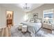 Bedroom with a neutral color palette, and direct access to a modern bathroom at 10205 Birch Bluff Ln, Las Vegas, NV 89145