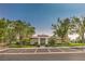 View of the community clubhouse featuring a well-maintained exterior and ample parking at 10205 Birch Bluff Ln, Las Vegas, NV 89145