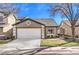 Charming single-Gathering home featuring a well-manicured lawn and attached two-car garage at 10205 Birch Bluff Ln, Las Vegas, NV 89145