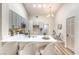 Bright kitchen features quartz countertops, stainless steel appliances, and eat-in breakfast bar at 10205 Birch Bluff Ln, Las Vegas, NV 89145