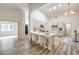 Open-concept kitchen offers a breakfast bar, modern cabinetry, stainless appliances, and ample counter space at 10205 Birch Bluff Ln, Las Vegas, NV 89145