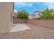 Low maintenance backyard featuring gravel landscaping and concrete patio at 10630 Lunar Crest Ave, Las Vegas, NV 89129