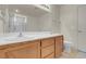 Modern bathroom showcasing dual sinks and a walk-in shower at 10630 Lunar Crest Ave, Las Vegas, NV 89129