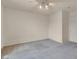 Bedroom featuring neutral colored walls, grey carpet and a ceiling fan at 10630 Lunar Crest Ave, Las Vegas, NV 89129
