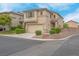 Two-story home featuring a well-maintained yard and attached two-car garage at 10630 Lunar Crest Ave, Las Vegas, NV 89129