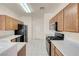Kitchen boasting tile floors, standard appliances and wood cabinets with plenty of storage at 10630 Lunar Crest Ave, Las Vegas, NV 89129