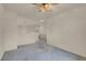 Upstairs living room with fan, carpeting, and bright light fixtures at 10630 Lunar Crest Ave, Las Vegas, NV 89129