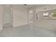 Bright living room featuring tile flooring, open archways, and neutral walls at 10630 Lunar Crest Ave, Las Vegas, NV 89129