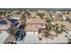 Aerial view of home with tile roof, mature landscaping, sparkling pool and ample parking at 1066 Aspen Valley Ave, Las Vegas, NV 89123