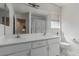 Bright bathroom with double sink vanity, large mirror and a shower-tub combination at 1066 Aspen Valley Ave, Las Vegas, NV 89123