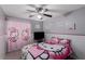 Charming bedroom featuring Hello Kitty themed decor, ceiling fan and television at 1066 Aspen Valley Ave, Las Vegas, NV 89123
