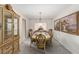 Elegant dining room with a classic wood table, decorative china cabinet, and tasteful artwork on the wall at 1066 Aspen Valley Ave, Las Vegas, NV 89123