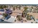 Eye-level view of home's exterior, with a balcony, front yard landscaping, and three-car driveway at 1066 Aspen Valley Ave, Las Vegas, NV 89123