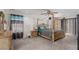 Primary bedroom offering a four-poster bed, ceiling fan, and sliding door access at 1066 Aspen Valley Ave, Las Vegas, NV 89123