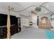 Large main bedroom with a four-poster bed, fireplace, and entertainment center at 1066 Aspen Valley Ave, Las Vegas, NV 89123