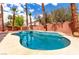 Inviting backyard pool with a spa, surrounded by mature landscaping and a privacy fence at 1066 Aspen Valley Ave, Las Vegas, NV 89123