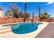 Backyard features a private pool, patio and lush landscaping at 1066 Aspen Valley Ave, Las Vegas, NV 89123