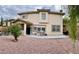 Spacious backyard featuring a covered patio, gravel landscaping, and well-maintained exterior of this stunning home at 11074 Caramel Crest Ct, Las Vegas, NV 89135