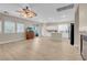 Spacious living area features plank flooring, ample natural light, and an open layout connected to the kitchen at 11074 Caramel Crest Ct, Las Vegas, NV 89135